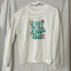 White crew neck sweatshirt colorful graphic that reads "ALWAYS IN A GOOD MOOD"
